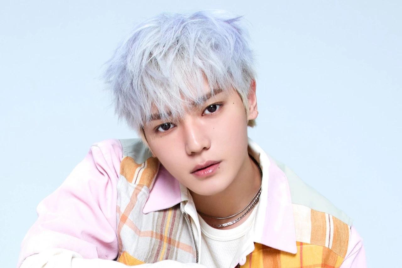 Taeyong in a pastel official portrait used during the WYLD album announcement rollout
