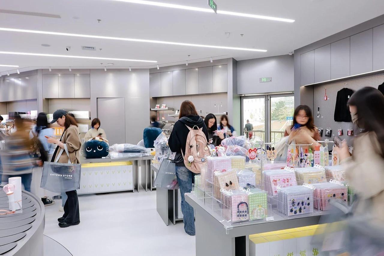 Fans browsing merchandise inside SMTown Store Shanghai, SM Entertainment's new official offline store in China