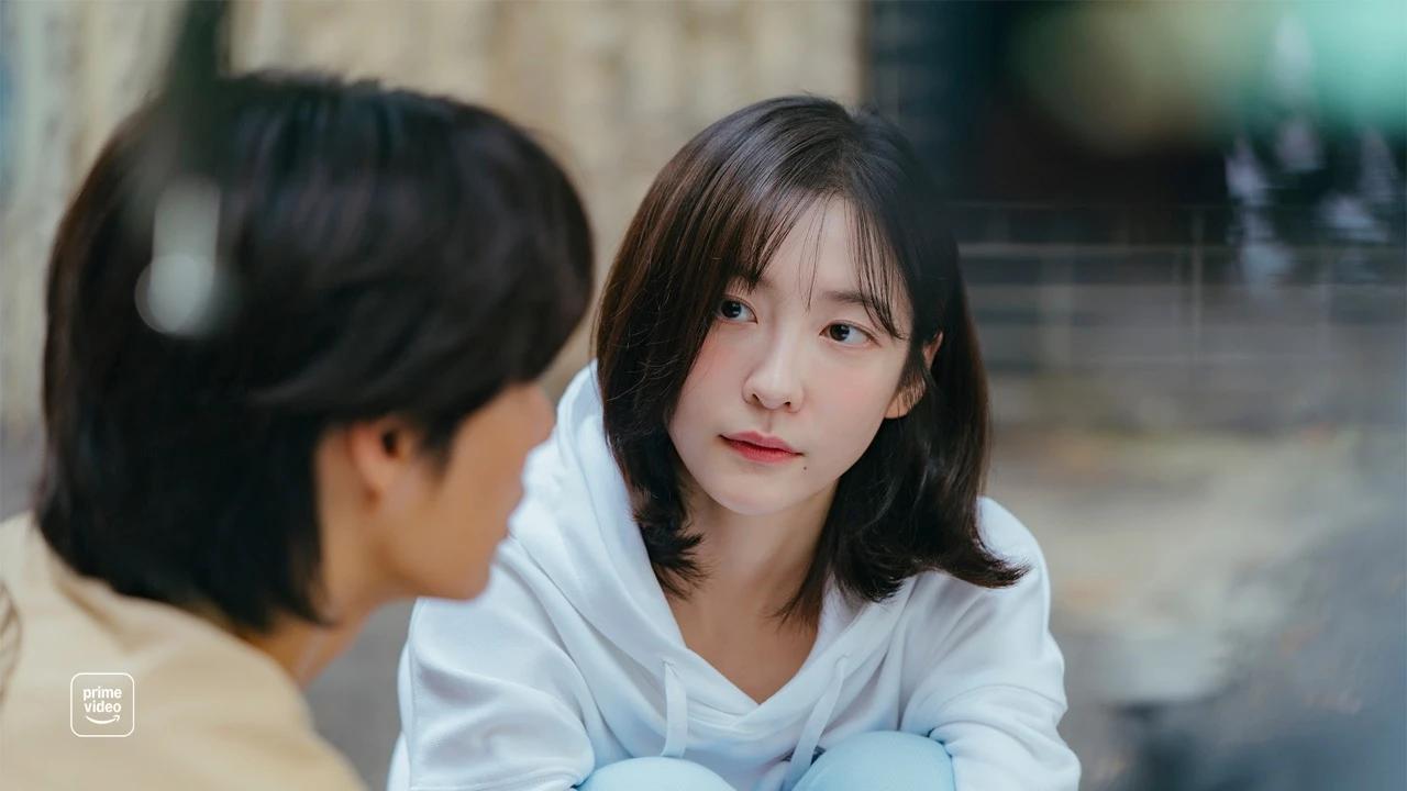 Park Ji-hyun shares a quiet moment in an official See You at Work Tomorrow! drama still from Prime Video