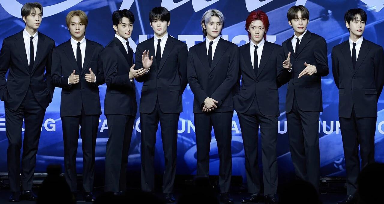NCT 127 members at the Fact Check press conference in October 2023