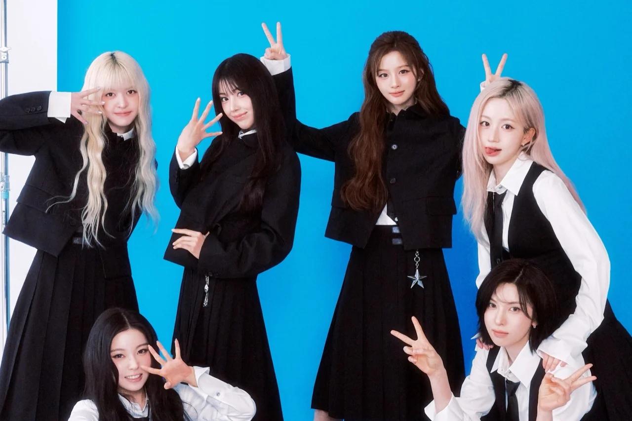 NMIXX promotional group image against a blue backdrop ahead of the Heavy Serenade comeback